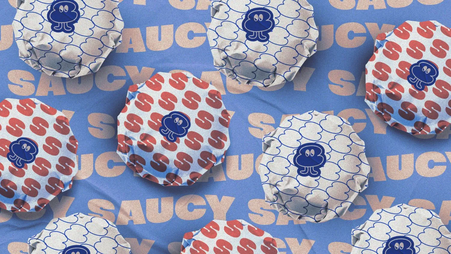 Papeles de envolver hamburguesas de Saucy con el patrón de la S y el personaje de salsa